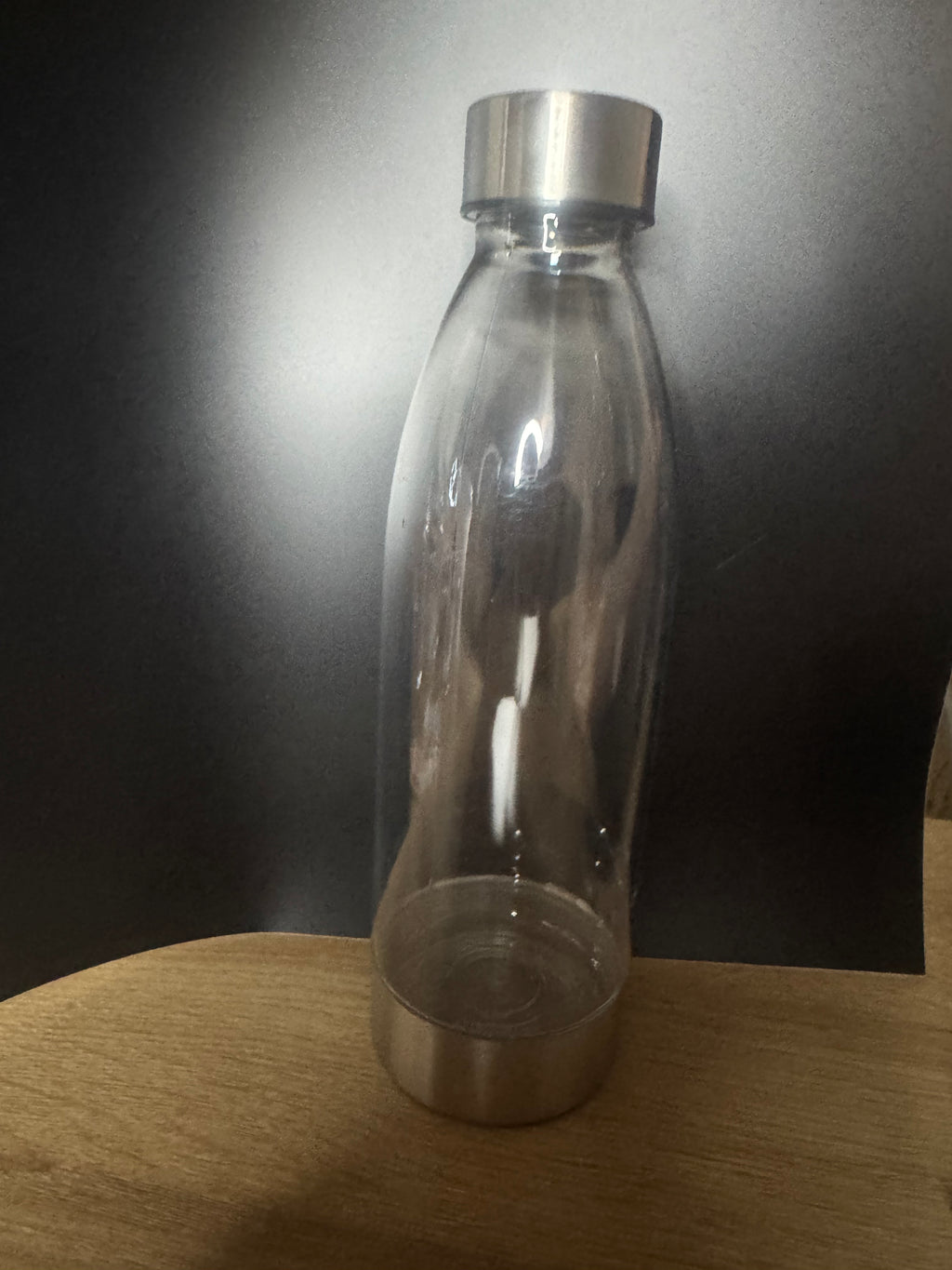 Plastic bottle with stainless steel lid
